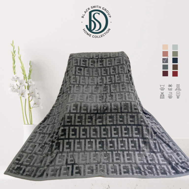 Soft luxury blanket 220x240 cm in cream color, neatly folded, showing smooth texture.