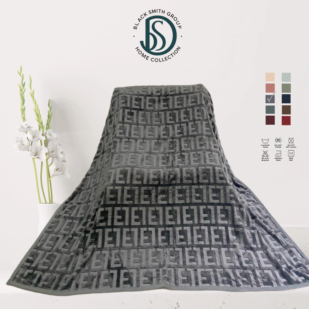 Soft luxury blanket 220x240 cm in cream color, neatly folded, showing smooth texture.