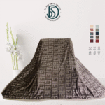 Soft luxury blanket 220x240 cm in cream color, neatly folded, showing smooth texture.